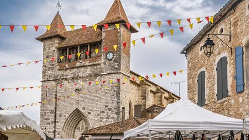 Landscape view of the facade of ancient Notre Dame church in medieval Villereal town, Lot-et-Garonne, France