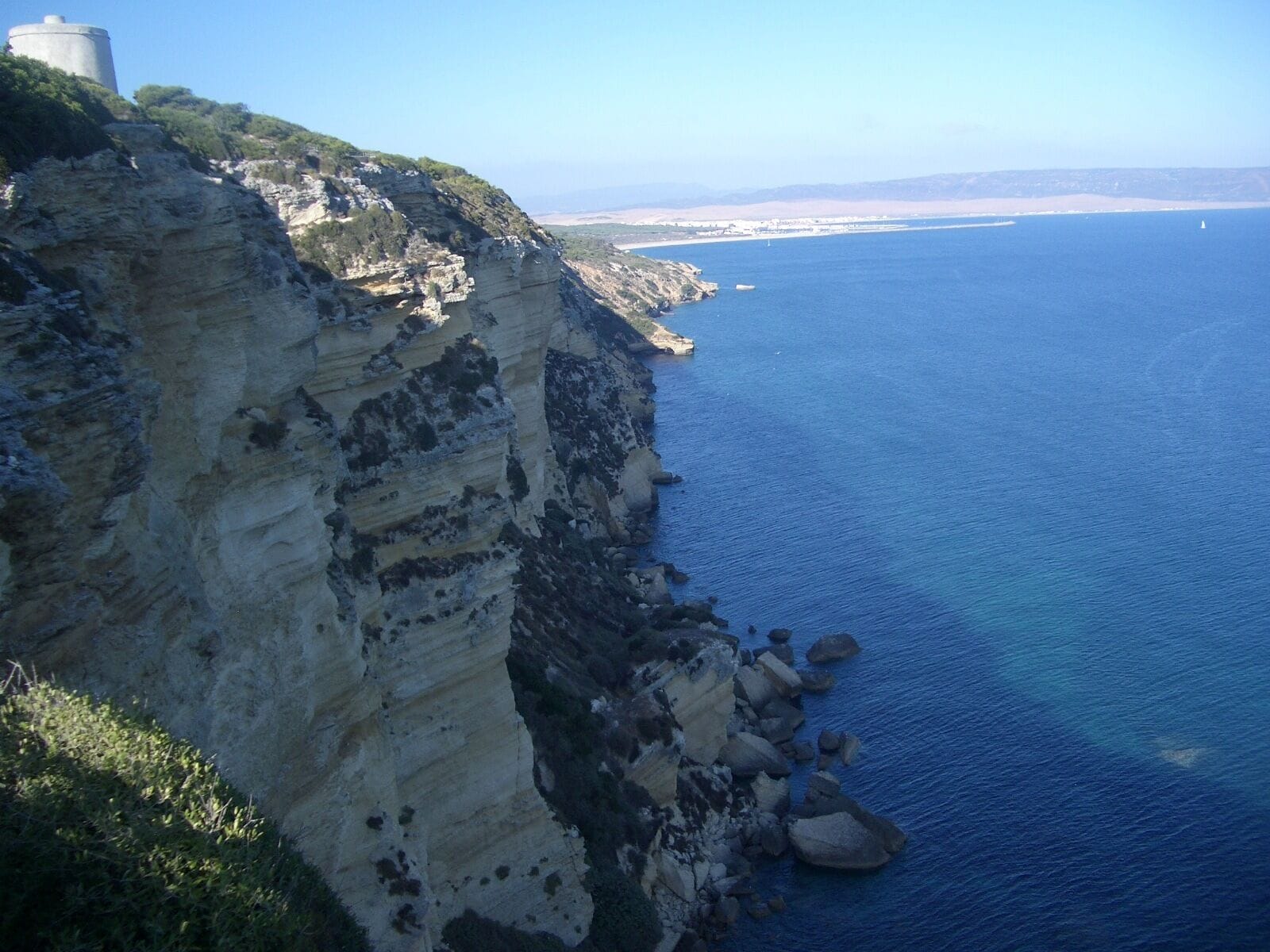 Distant view of Barbate and the coastline, taken near Torre del Tajor (visible to the left)