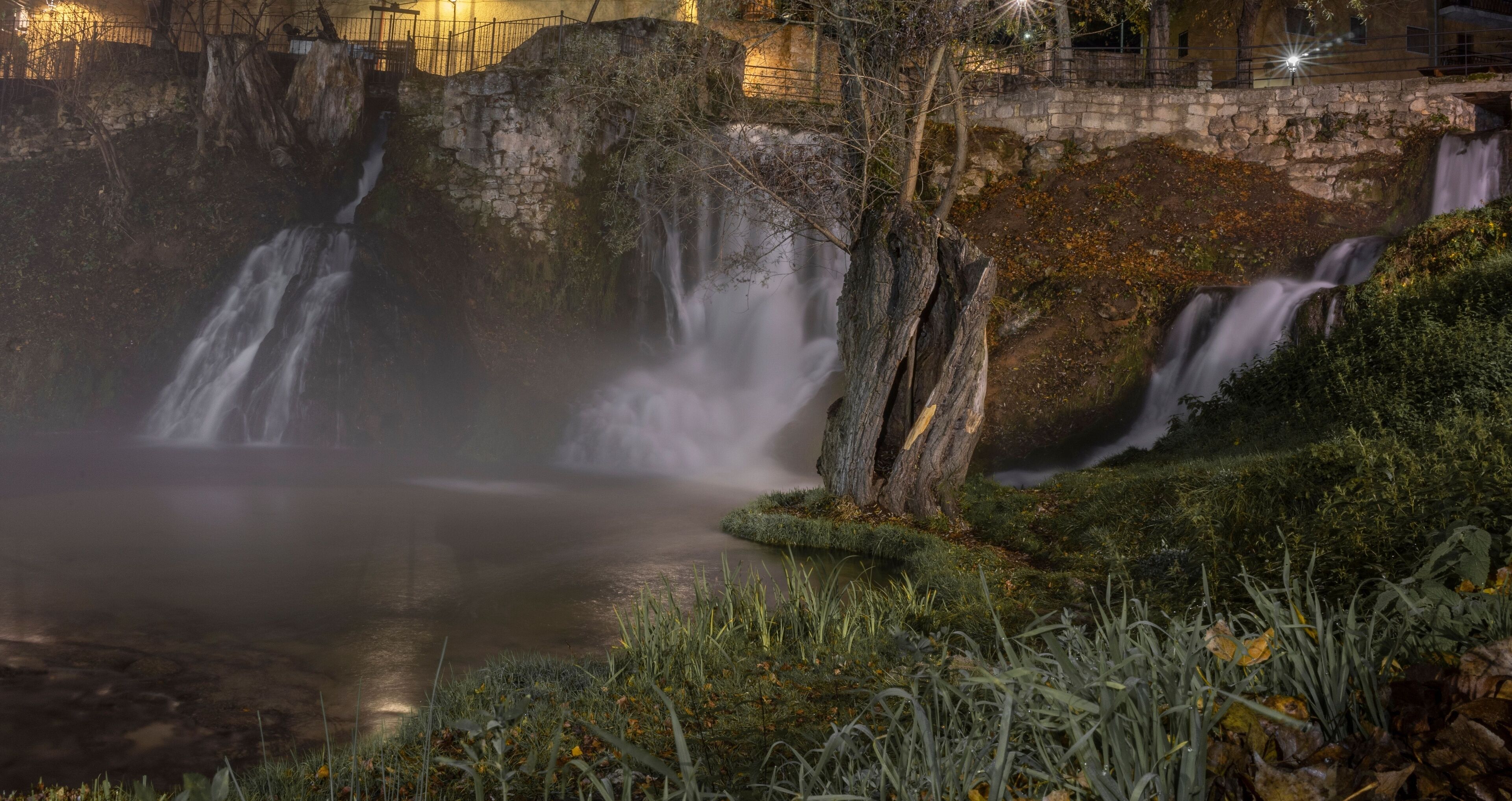 Beautiful waterfall in the town of Trillo at night, Guadalajara, Spain.
