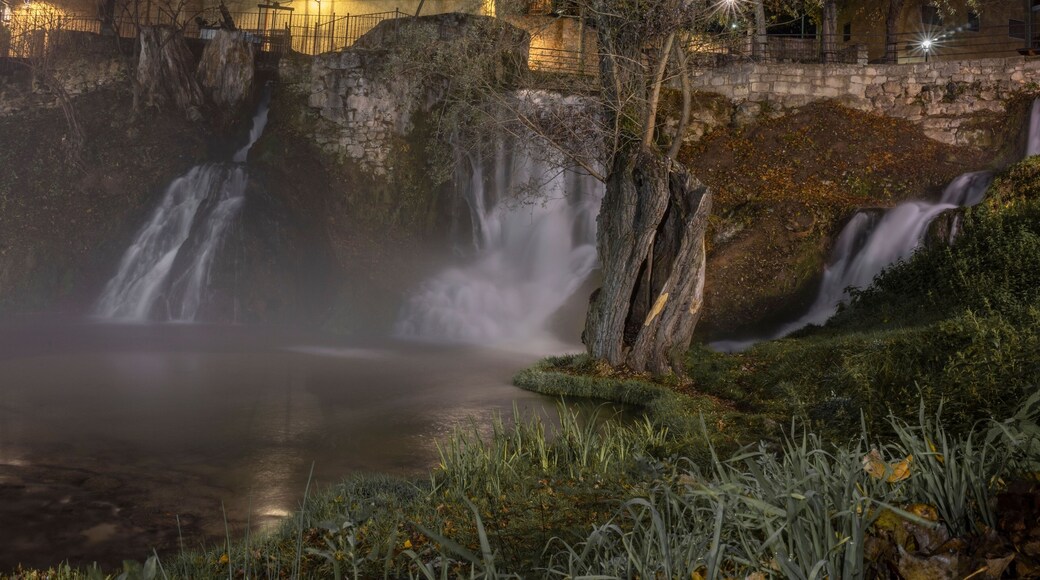 Beautiful waterfall in the town of Trillo at night, Guadalajara, Spain.
