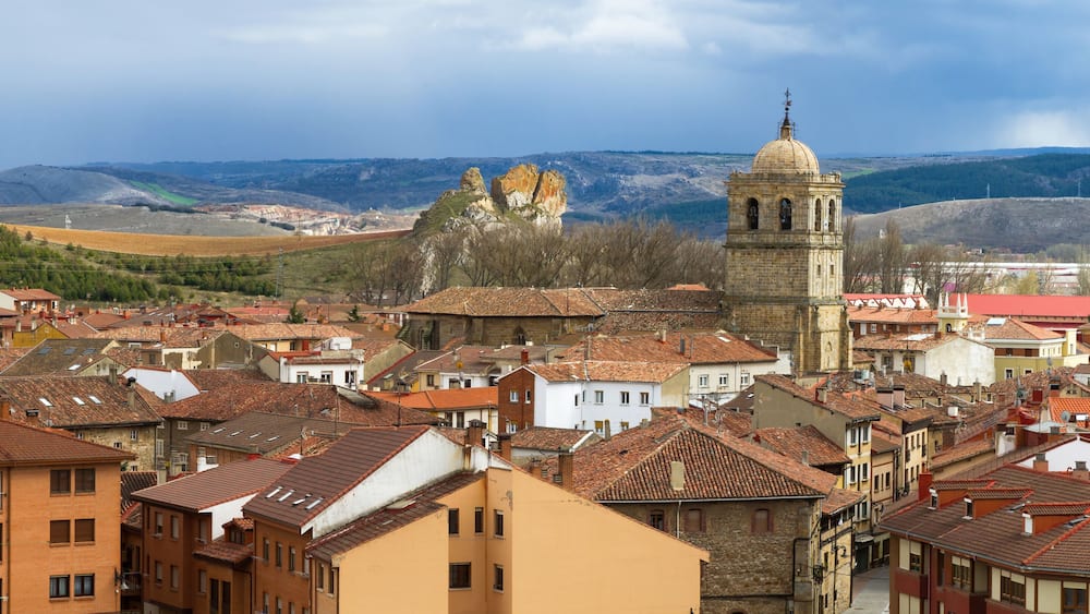 Locality of Aguilar de Campoo with the tower of the church exceling. Palencia Province, Spain