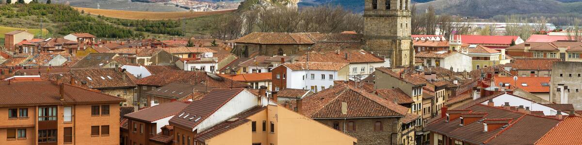 Locality of Aguilar de Campoo with the tower of the church exceling. Palencia Province, Spain