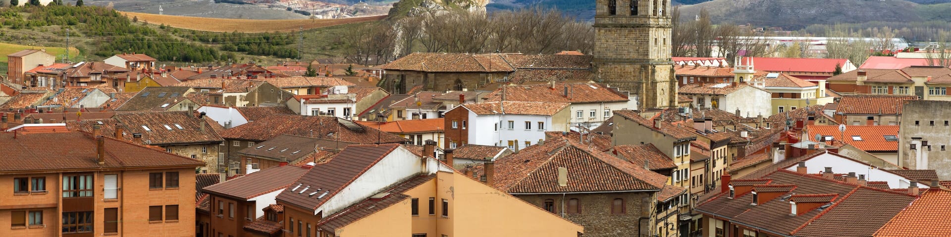 Locality of Aguilar de Campoo with the tower of the church exceling. Palencia Province, Spain