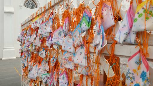 Velankanni, India: Many padlocks and rope on the church rods.