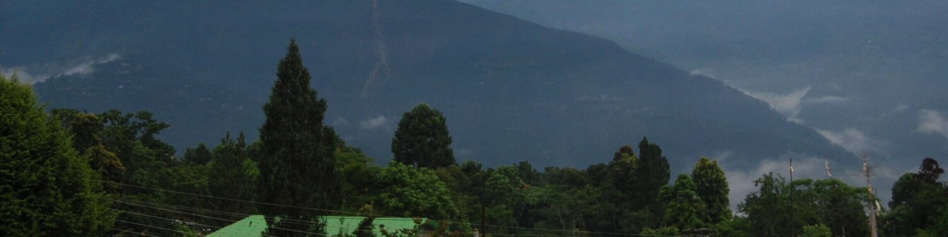 Kalimpong is a small hill town nestled in the Himalayas. Its less touristy thus calm and offers long walks, treks, meditation spots, exploring local market, nice places to eat and drink and above all happy people.
This picture is taken from the top floor room of Alaknanda Resort run by a friendly Mrs Subba. A nice place to stay.