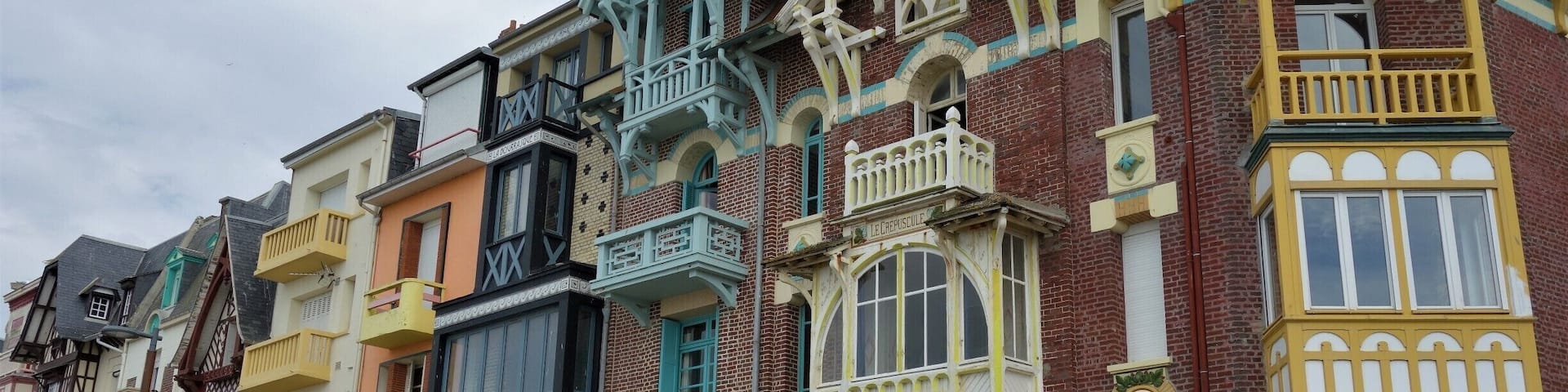 A row of colorful, ornate buildings with unique architectural details.