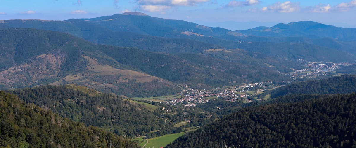 A mountainous landscape with a town nestled in the valley.