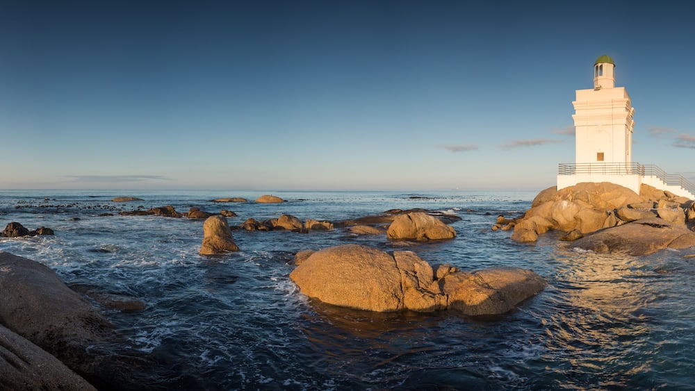 Wide angle panoramic image of the Stompneusbaai lighthouse near Shelley point in town of St Helena Bay on the West coast of South Africa