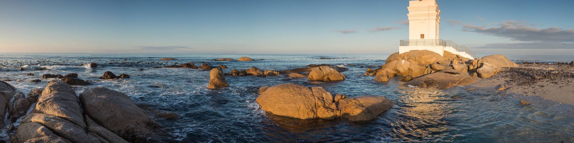 Wide angle panoramic image of the Stompneusbaai lighthouse near Shelley point in town of St Helena Bay on the West coast of South Africa