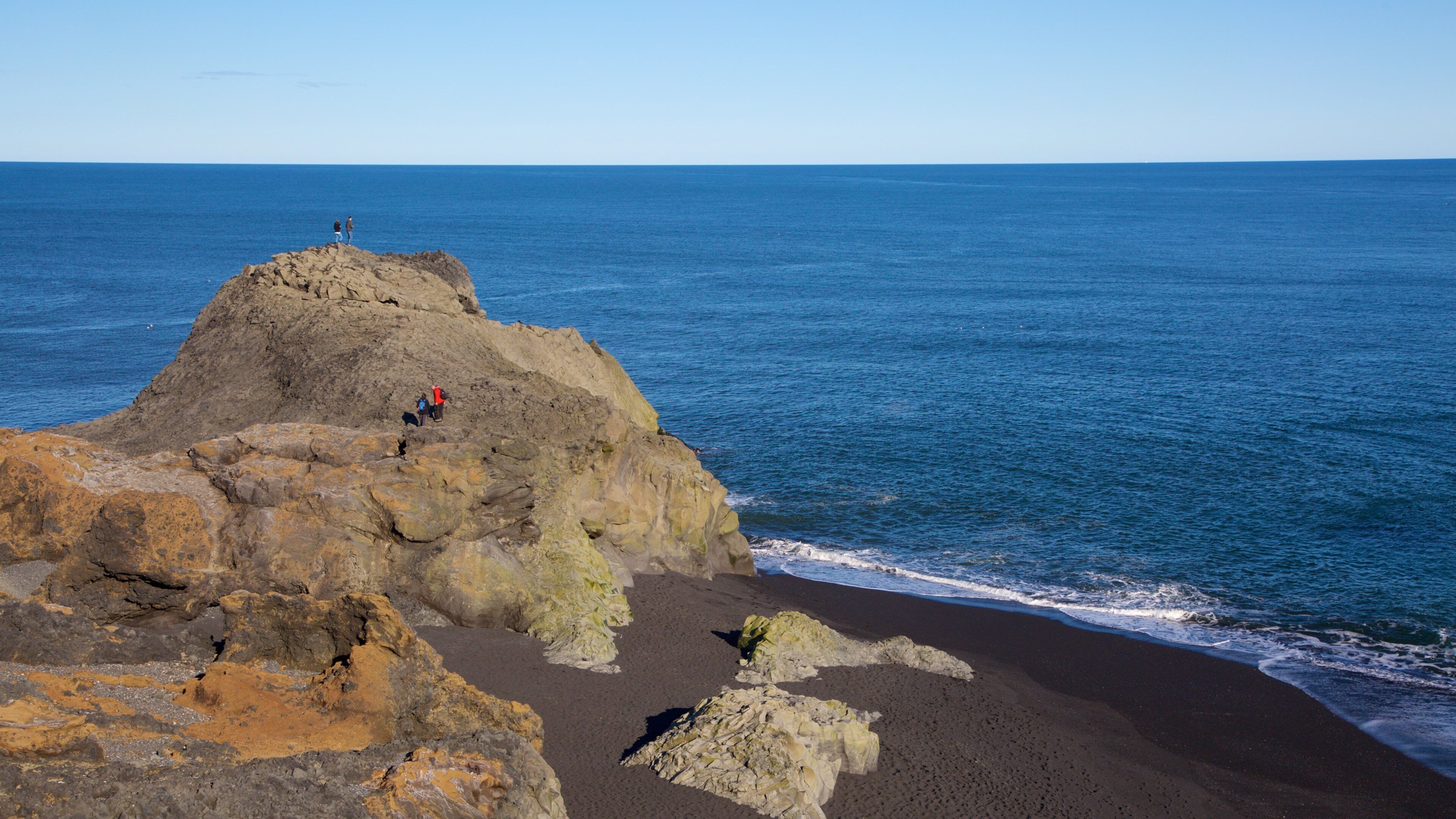 Dyrholaey which includes general coastal views