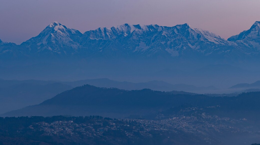 Aerial view of Garwal Himalayas at dawn with mist and fog, Mukteshwar, Uttarakhand, India.