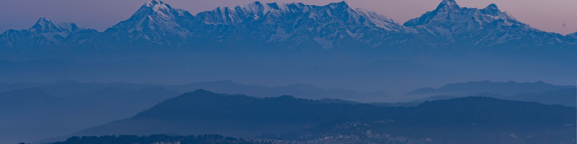 Aerial view of Garwal Himalayas at dawn with mist and fog, Mukteshwar, Uttarakhand, India.