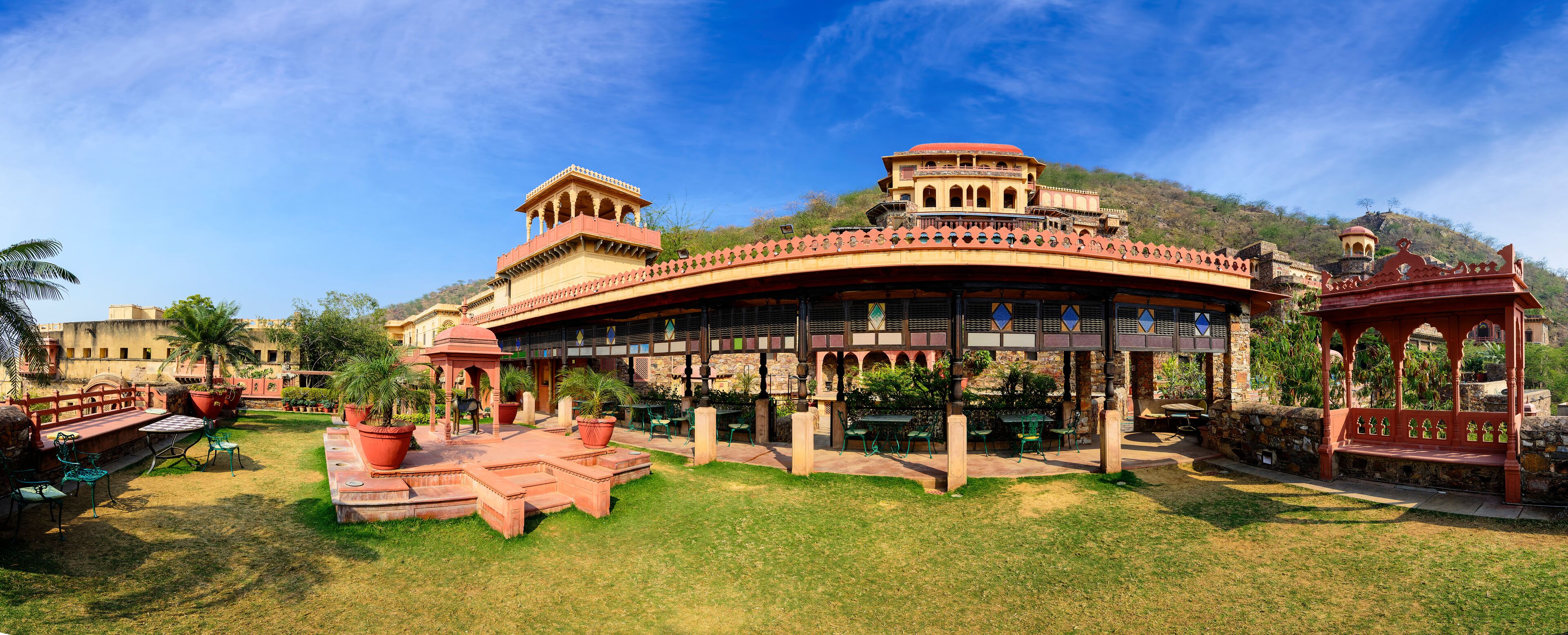 A traditional building with a curved roof and a tower.