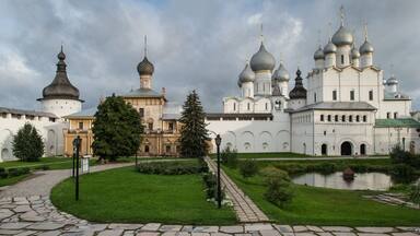 A historic church with multiple domes and a large bell tower.