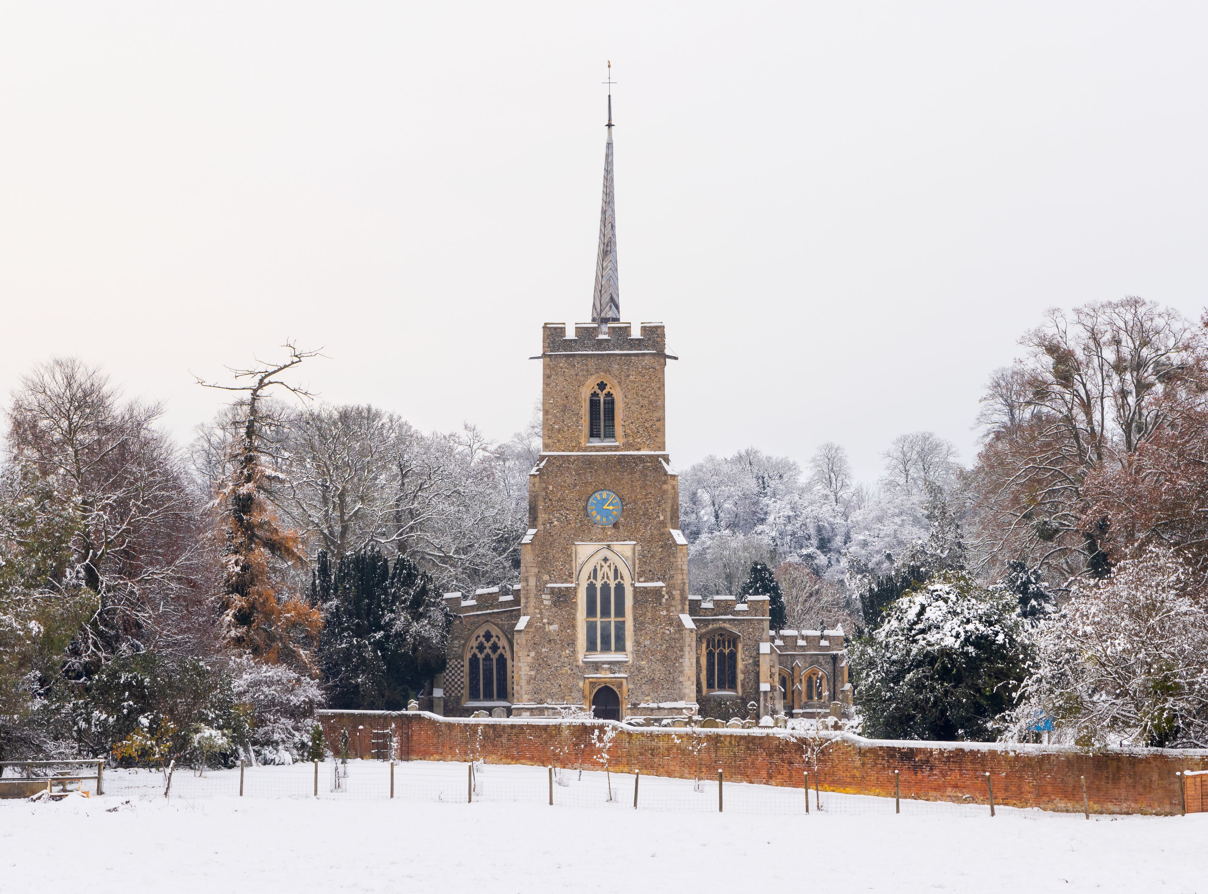 Traditional English village church covered in Snow. St Andrews Church, Much Hadham, Hertfordshire. UK