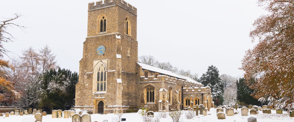 Traditional English village church covered in Snow. St Andrews Church, Much Hadham, Hertfordshire. UK