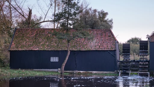 Typical Dutch two wheeled watermill 'Collse Molen' at dusk in the Netherlands, near the city of Eindhoven - Painted by Vincent van Gogh.