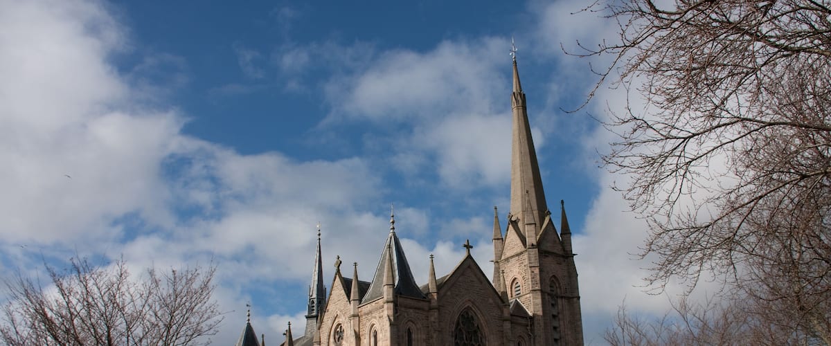 A large Gothic-style church with multiple spires and a prominent central tower.