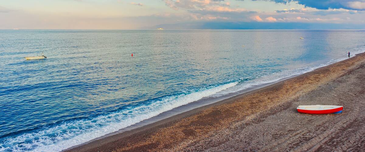 Beach at Mediterranean sea at Santa Teresa di Riva Messina reflex