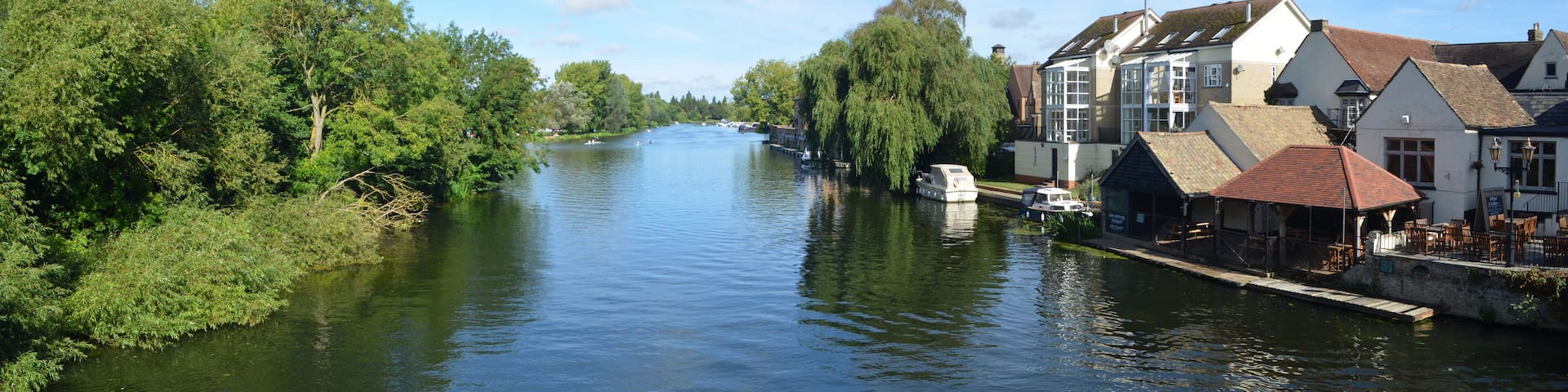 The river Ouse, Regatta meadows and riverside buildings at St Neots Cambridgeshire England.