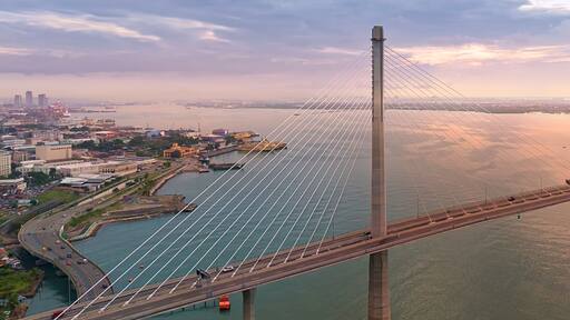 Dawn over the Cebu Cordova Link Expressway in Cebu City Philippines. Aerial View.
