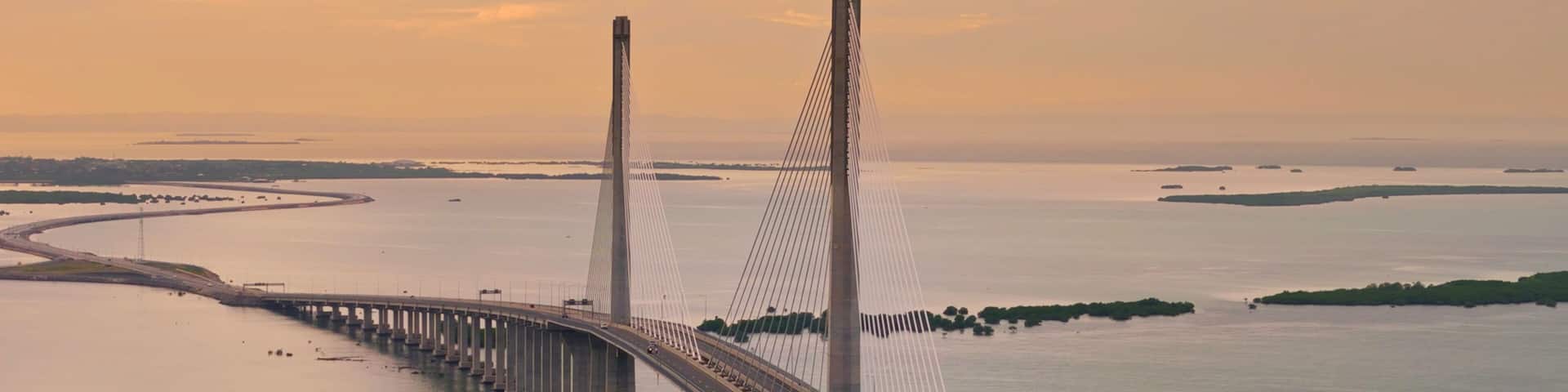 Sunrise over Cebu Cordova Link Expressway, CCLEX. Looking towards Mactan across the Mactan Channel. Aerial Drone Photo.
