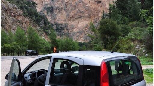 Driving through the gorge of Kleisoura.
The monastery of Panaghia Eleousa is carved in a rock on the gorge's limestone walls.