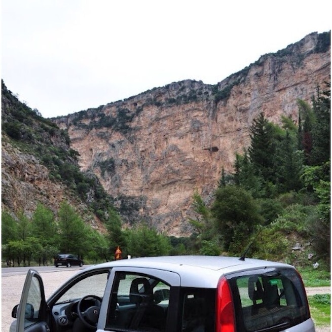 Driving through the gorge of Kleisoura. 
The monastery of Panaghia Eleousa is carved in a rock on the gorge's limestone walls.