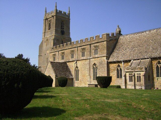 Long Compton church, near to Long Compton, Warwickshire, Great Britain. The path from the lych gate to the south door is lined with yew topiary.