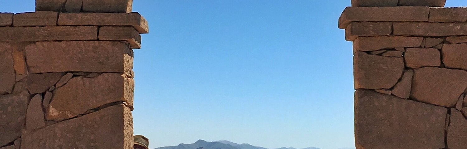A view of lake Titicaca from the Taquile island on a beautiful day through one the gates you find on the path going around the island