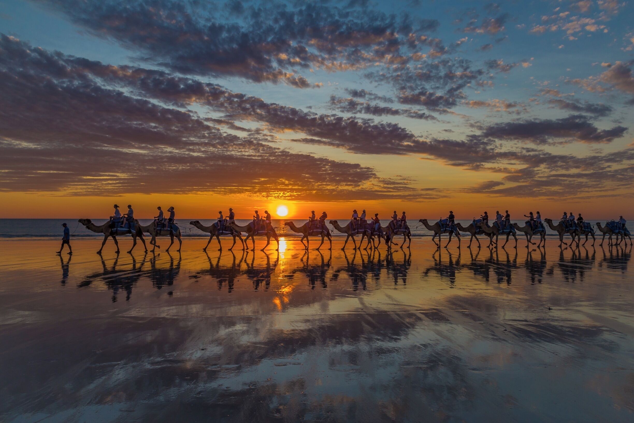 I had taken the camel ride the evening before and it was a cloudless sunset... so glad that this sunset wasn't - such a cool sky with the reflections in the sand... I enjoyed photographing it a lot more than I enjoyed my camel ride though...    Tip:  the Blue Camels are closer to the sea than the Red or the Yellow also the wet sand makes for great reflections  #Reflections #beachtips