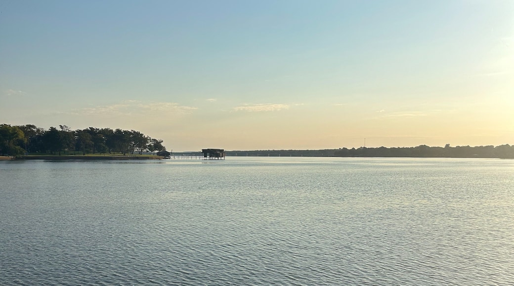Relaxing lakefront view at Cedar Creek Reservoir in Texas during golden hour