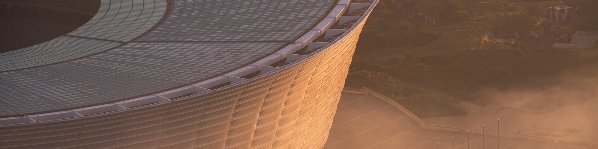 Estadio de Ciudad del Cabo mostrando una ciudad y una puesta de sol
