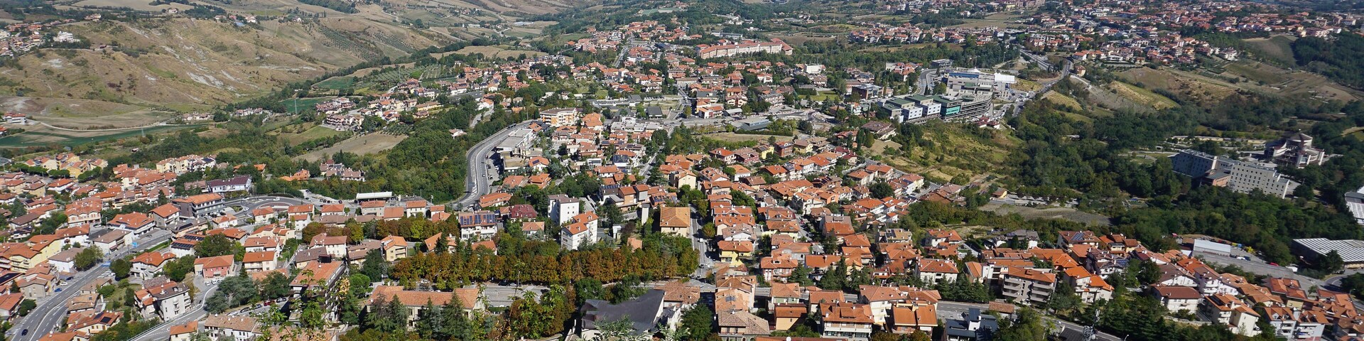Panorama of Republic of San Marino and Italy from Monte Titano, City of San Marino. City of San Marino is capital city of Republic of San Marino located on Italian peninsula, near Adriatic Sea.