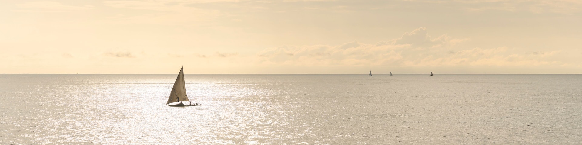 Dhow fishing boat at sunrise at Watamu Bay Beach, Watamu, Kilifi County, Kenya
