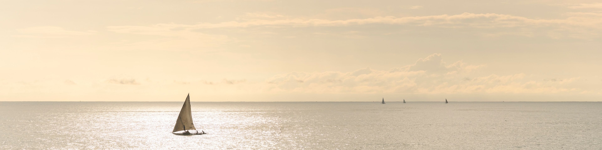 Dhow fishing boat at sunrise at Watamu Bay Beach, Watamu, Kilifi County, Kenya