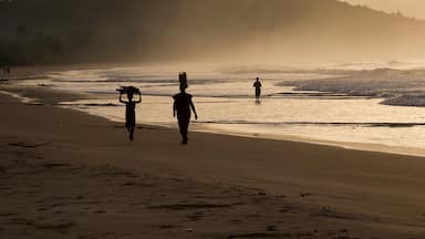 Woman and girl at sunrise. Busua Beach, Ghana