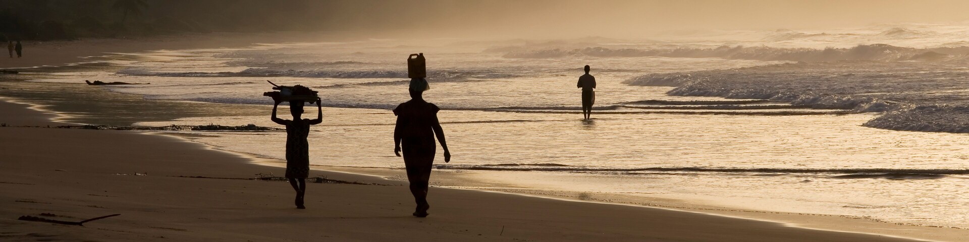 Woman and girl at sunrise. Busua Beach, Ghana