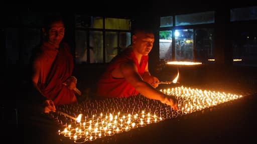 Buddhist monks light 'deeyas' (oil lamps) in the 'Prayer light room' in Mahabodhi Temple.
Its a sight to see as the room comes up with hundreds of 'deeyas'. You can also join in as volunteer and donate oil or candles to contribute.