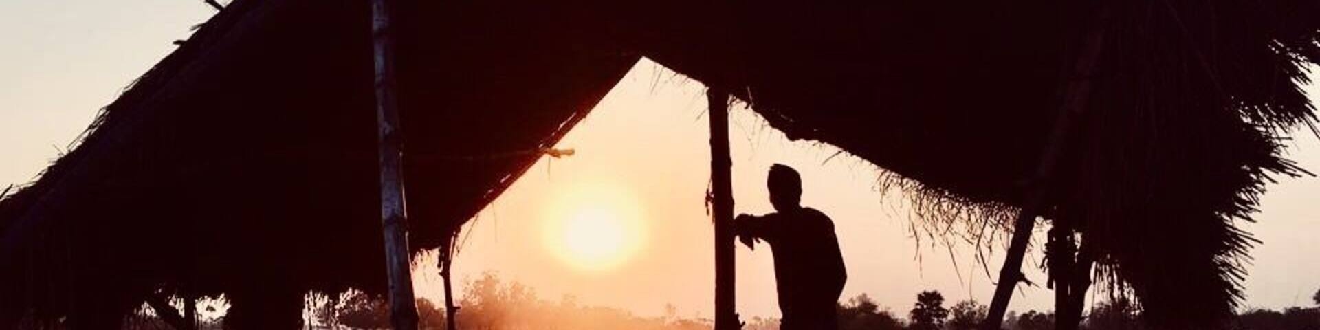 Beautiful sunset under hut. Silhouette