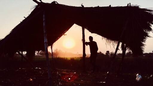Beautiful sunset under hut. Silhouette