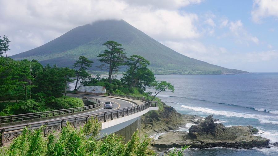Aerial view of the bay with the highway into volcano mountain in Japan. Kaimondake Mountain, Ibusuki, Kagoshima, 開聞岳 鹿児島県指宿市