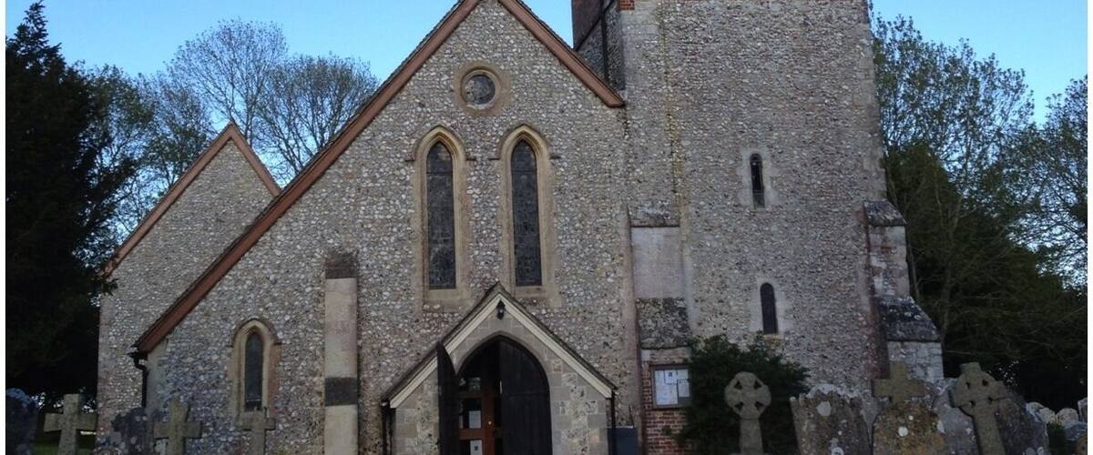 A church with a tower and a flag.