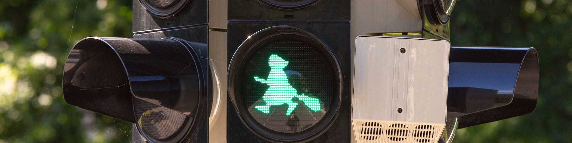 Image of a witch on a broomstick at a traffic light in Wernigerode. Germany.