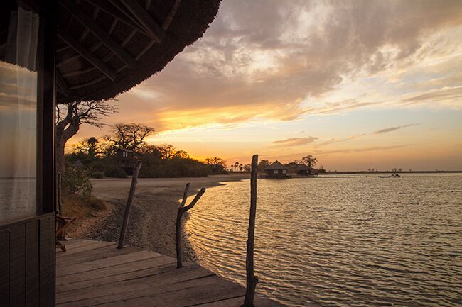 Lodge de Niassam is a eco lodge in paradise! You can live in 3 different cabins; hut on stilts in the lagune, a tree hut in a Baobab tree or a beautiful cabin on the ground. Sunset enjoyed from our terrace!
Read more on: http://www.travelwithallsenses.com/lodge-de-niassam-eco-lodge-paradise/