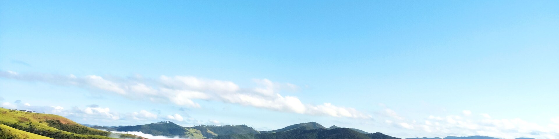 Fog in a dawn in a mountain landscape in the rural area of Itabira, Minas Gerais, Brazil.