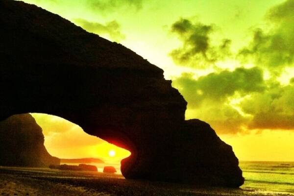 Sunset by the weird rock formations in legzira beach, Morocco #morocco #legzira #sunset #travelphotography #bigh