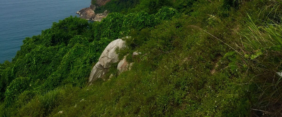 View from the Hai Van Pass, a 21km mountain pass between Hue and Danang, Vietnam. It's known to be one of the best coastal roads in the world. Best to do on motorbike or motorcycle - but only if you're comfortable enough!