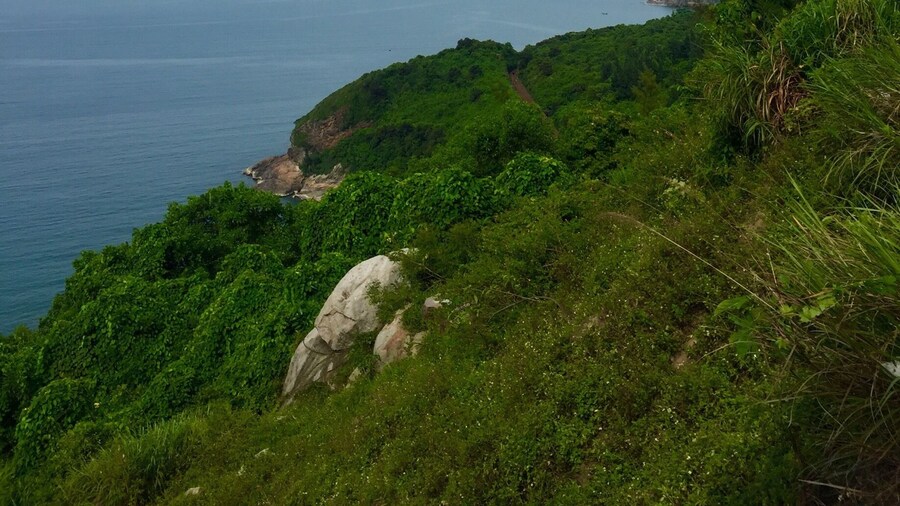 View from the Hai Van Pass, a 21km mountain pass between Hue and Danang, Vietnam. It's known to be one of the best coastal roads in the world. Best to do on motorbike or motorcycle - but only if you're comfortable enough!