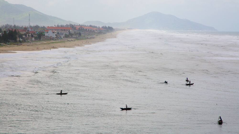 Lang Co featuring mist or fog, general coastal views and a sandy beach